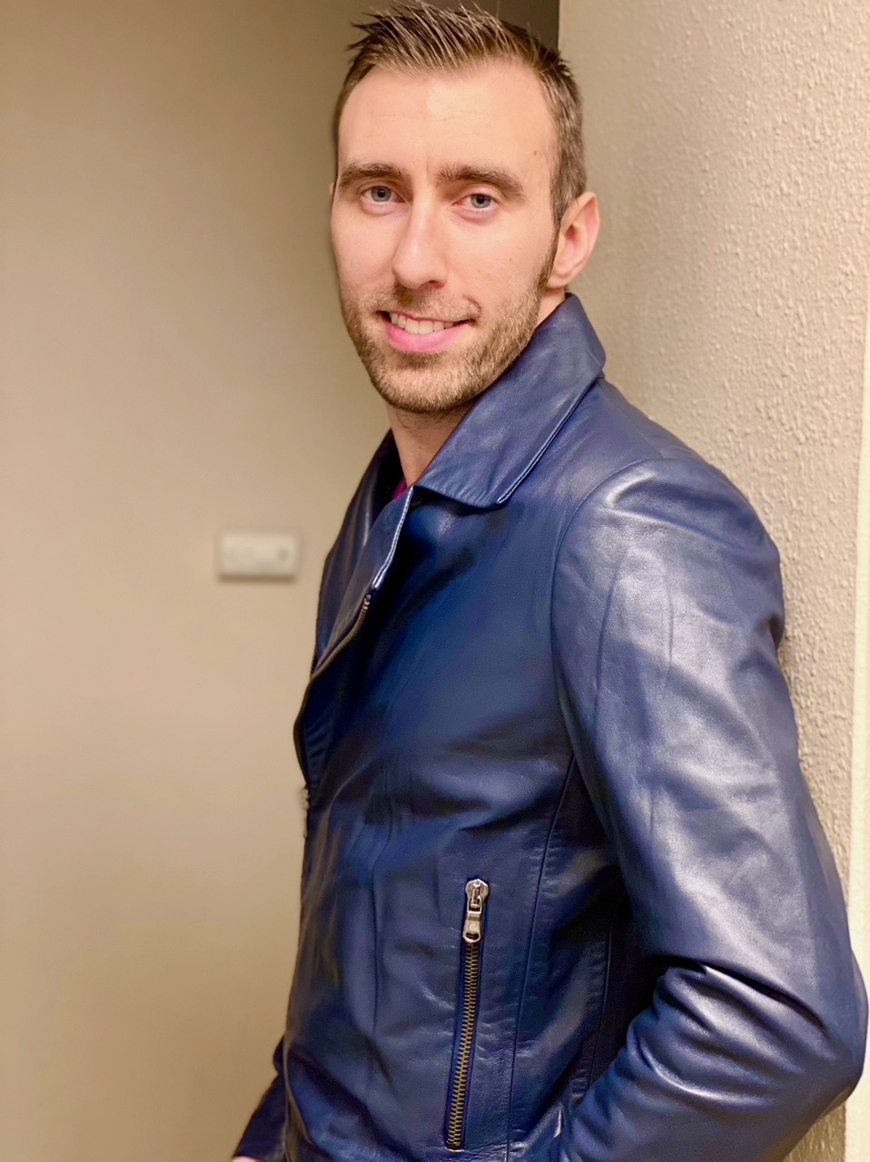 Pavel wearing a navy leather jacket